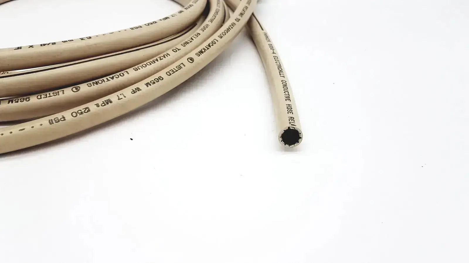Beige parker 5159-4 electrically conductive hose with black interior and printed specifications along its length