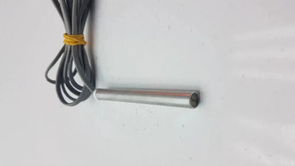 Gray coiled cable with yellow band connected to metallic cylindrical sensor for parks medical electronics mhz pencil doppler probe