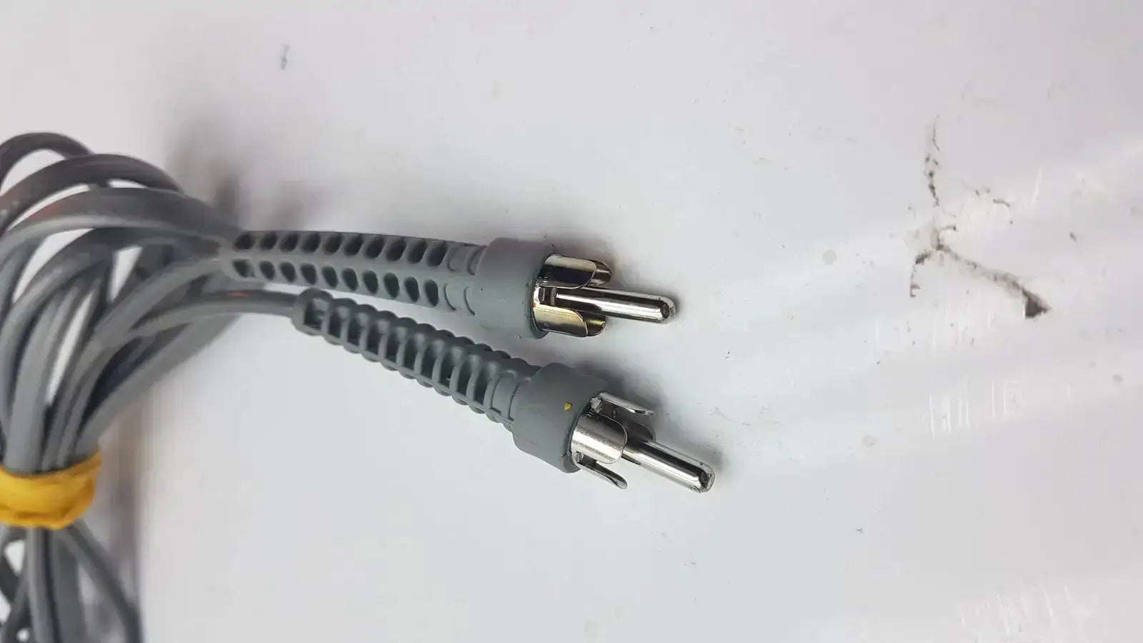 Gray rca audio video cable with metallic connectors and yellow tie for parks medical electronics mhz pencil doppler probe