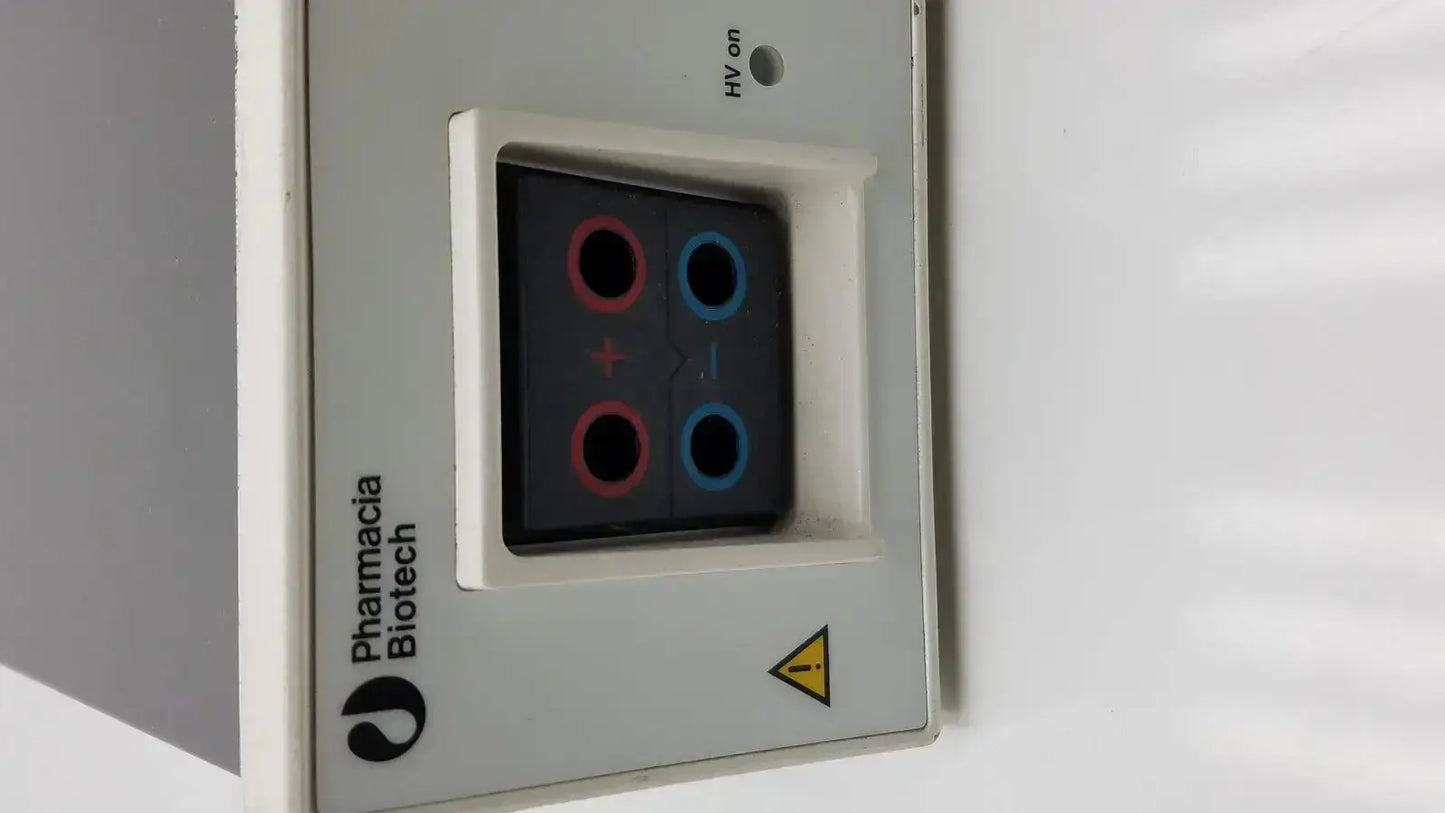 Gray rectangular pharmacia biotech eps 600 electrophoresis power supply with black display and red and blue circular indicators