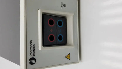 Gray rectangular pharmacia biotech eps 600 electrophoresis power supply with black display and red and blue circular indicators