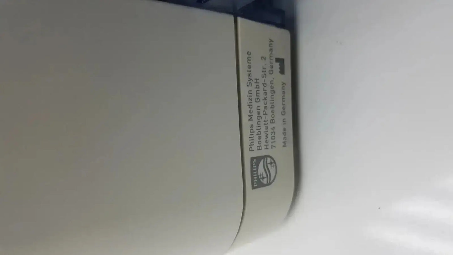 White philips medizin systeme label with black text and logo on the back of a philips intellivue mx700 bedside patient monitor