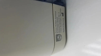 White philips medizin systeme label with black text and logo on the back of a philips intellivue mx700 bedside patient monitor