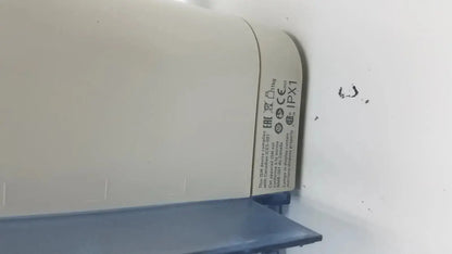 Beige plastic intellivue mx700 bedside patient monitor with curved top, blue base, and ce ipx1 certification labels visible