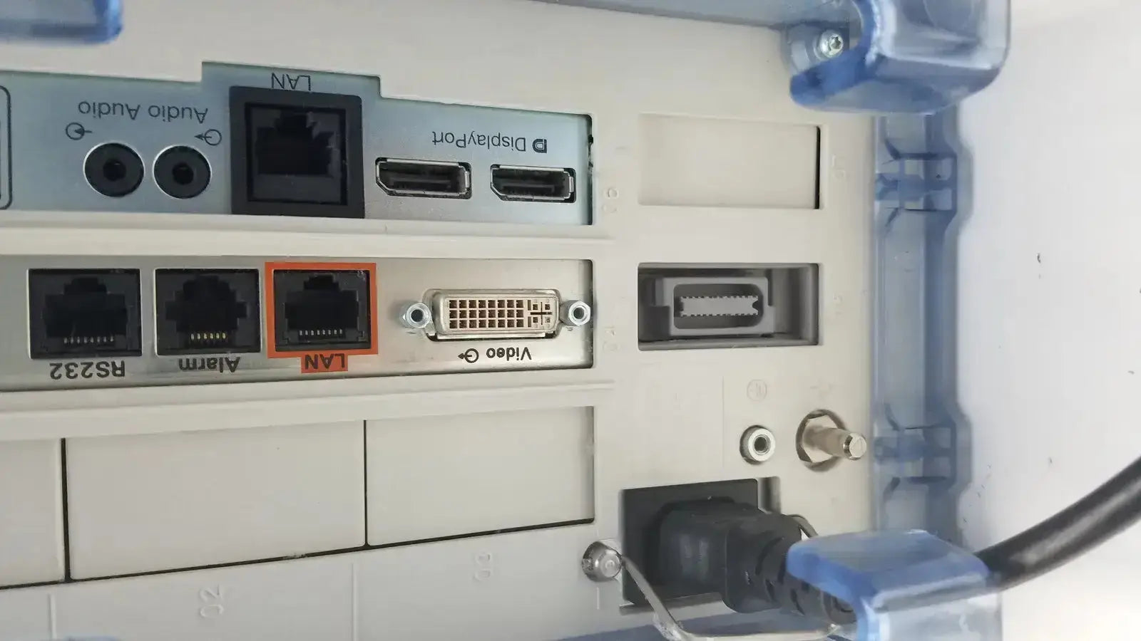 Beige plastic panel with ethernet hdmi and dvi ports on the back of philips intellivue mx700 bedside patient monitor