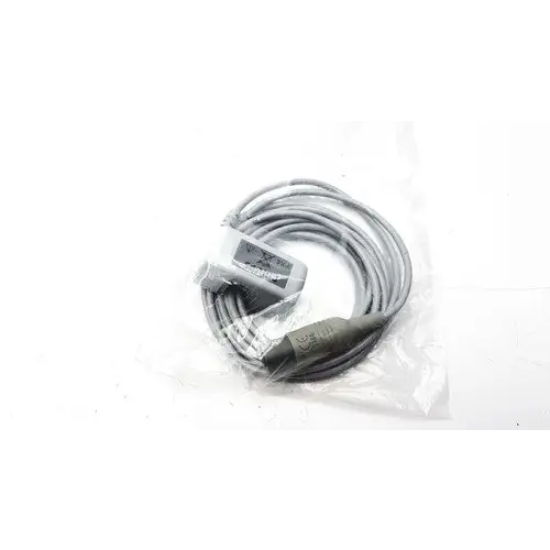 Gray coiled cable with a black connector and a small rectangular label on the housing.