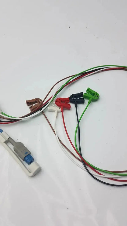 Multicolored philips ecg leads grabber with color-coded clips and white connector housing for hospital surplus use