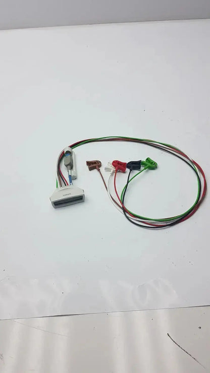 White plastic philips ecg leads grabber with multi-colored wires and colored alligator clips for hospital surplus use