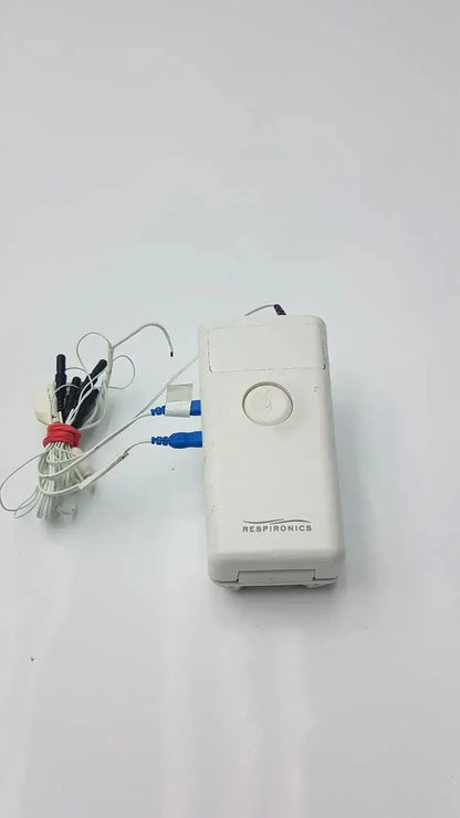 White rectangular philips healthcare respiironics aliice pdx portable oxygen concentrator with circular button and red tied tubing