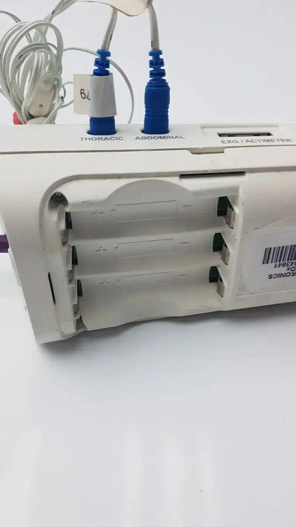 White plastic philips healthcare respiironics aliice pdx medical device with labeled thoracic abdominal ports and blue connectors