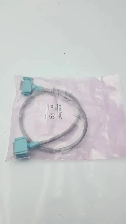 Light blue and gray philips intellivue m3081-61626 interface cable with two rectangular connectors in clear plastic bag