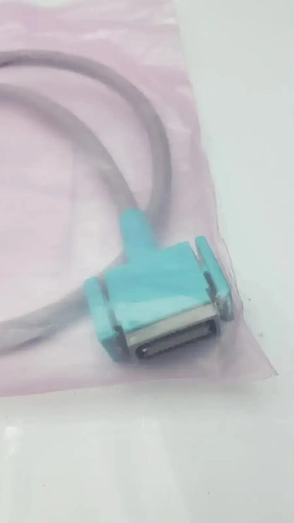 Light blue plastic philips intellivue m3081-61626 interface cable with white cable in clear packaging