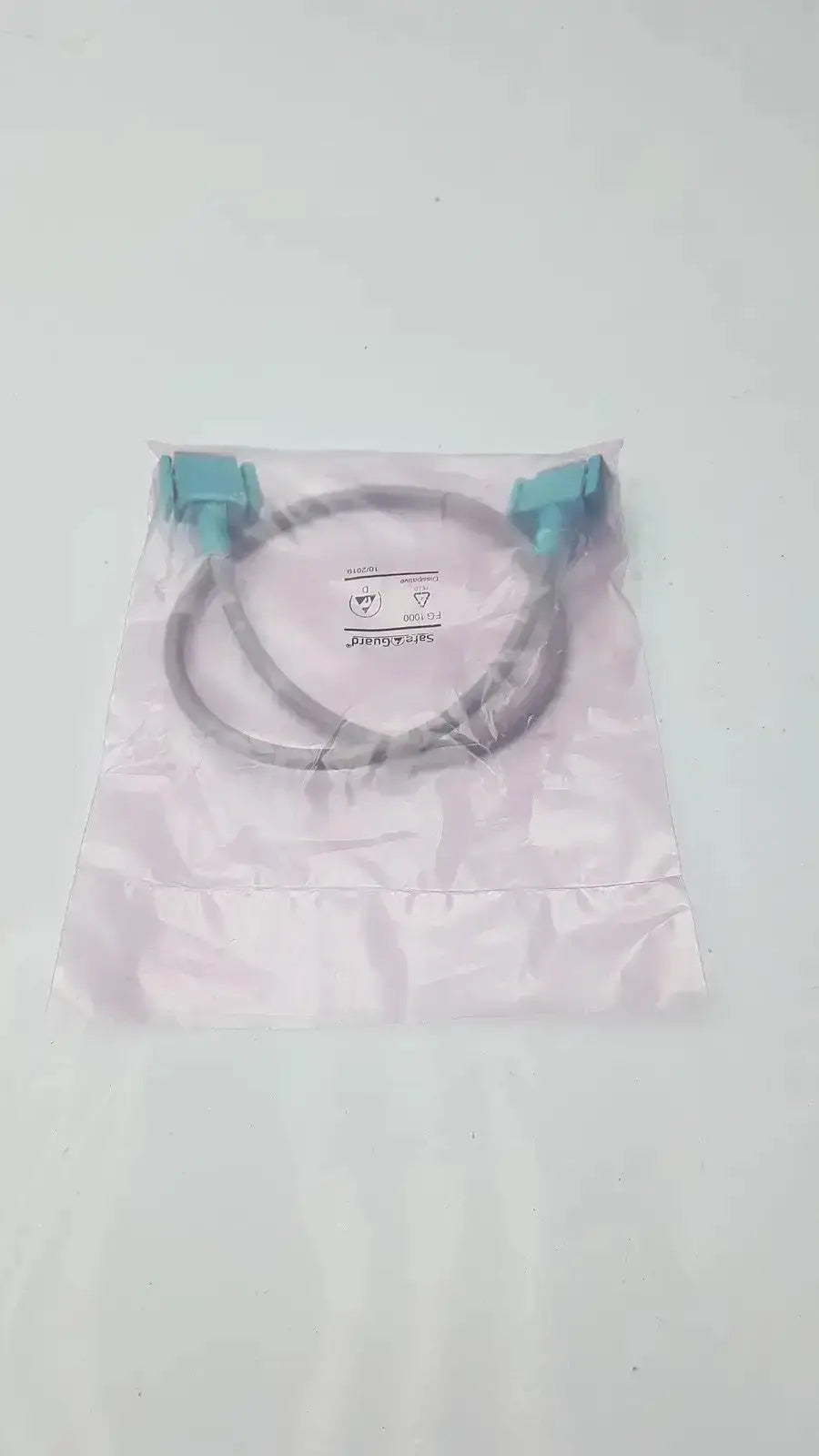 Light blue plastic interface cable in clear packaging for philips intellivue m3081-61626 medical device use