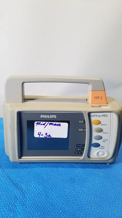 Beige philips intellivue mp2 portable patient monitor with touchscreen display and color-coded control buttons medical equipment
