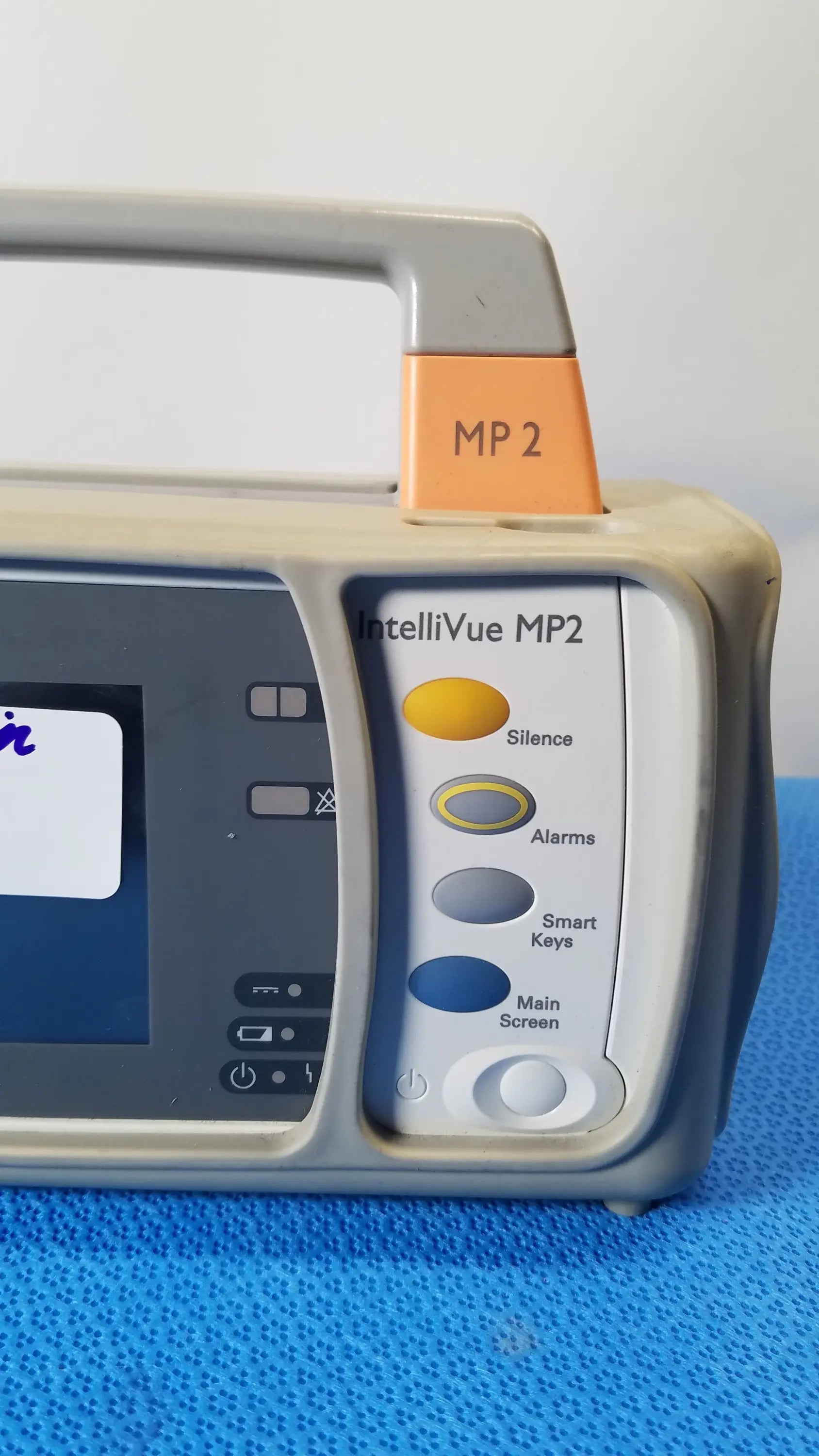 Philips intellivue mp2 portable medical equipment gray and beige monitor with handle and color-coded circular buttons