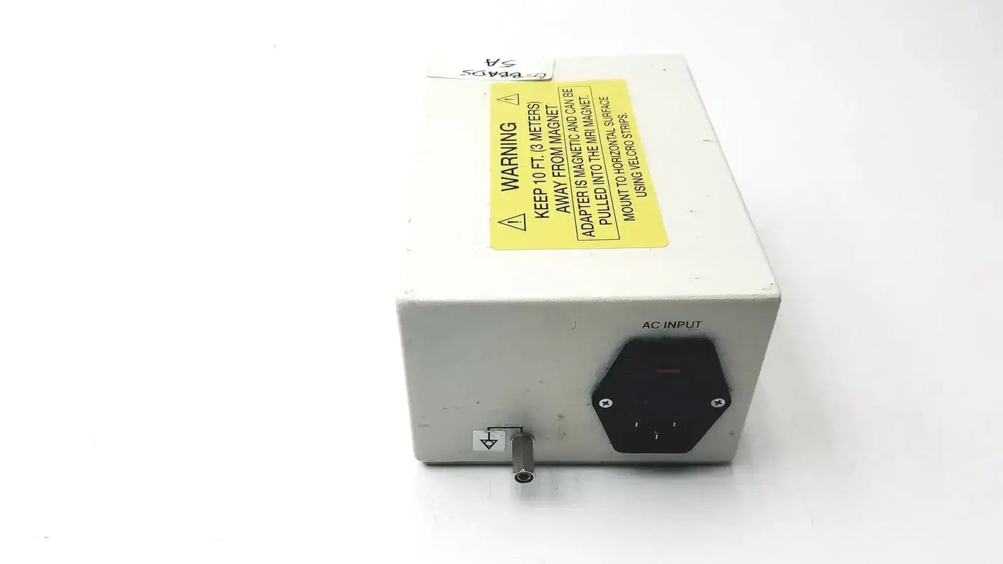 White rectangular philips invivo mri ac adapter as201 with black hexagonal ac input port and yellow warning label backside view