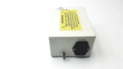 White rectangular philips invivo mri ac adapter as201 with black hexagonal ac input port and yellow warning label backside view
