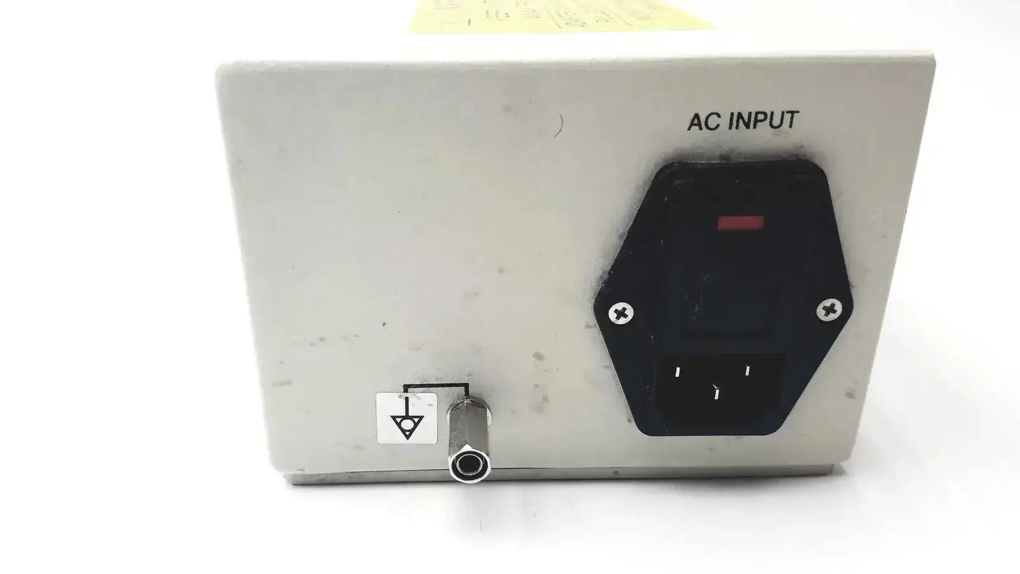 White rectangular philips invivo adapter as201 with black hexagonal ac input socket and metallic grounding port back side mri ac adapter