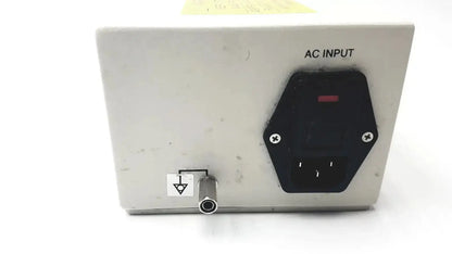 White rectangular philips invivo adapter as201 with black hexagonal ac input socket and metallic grounding port back side mri ac adapter