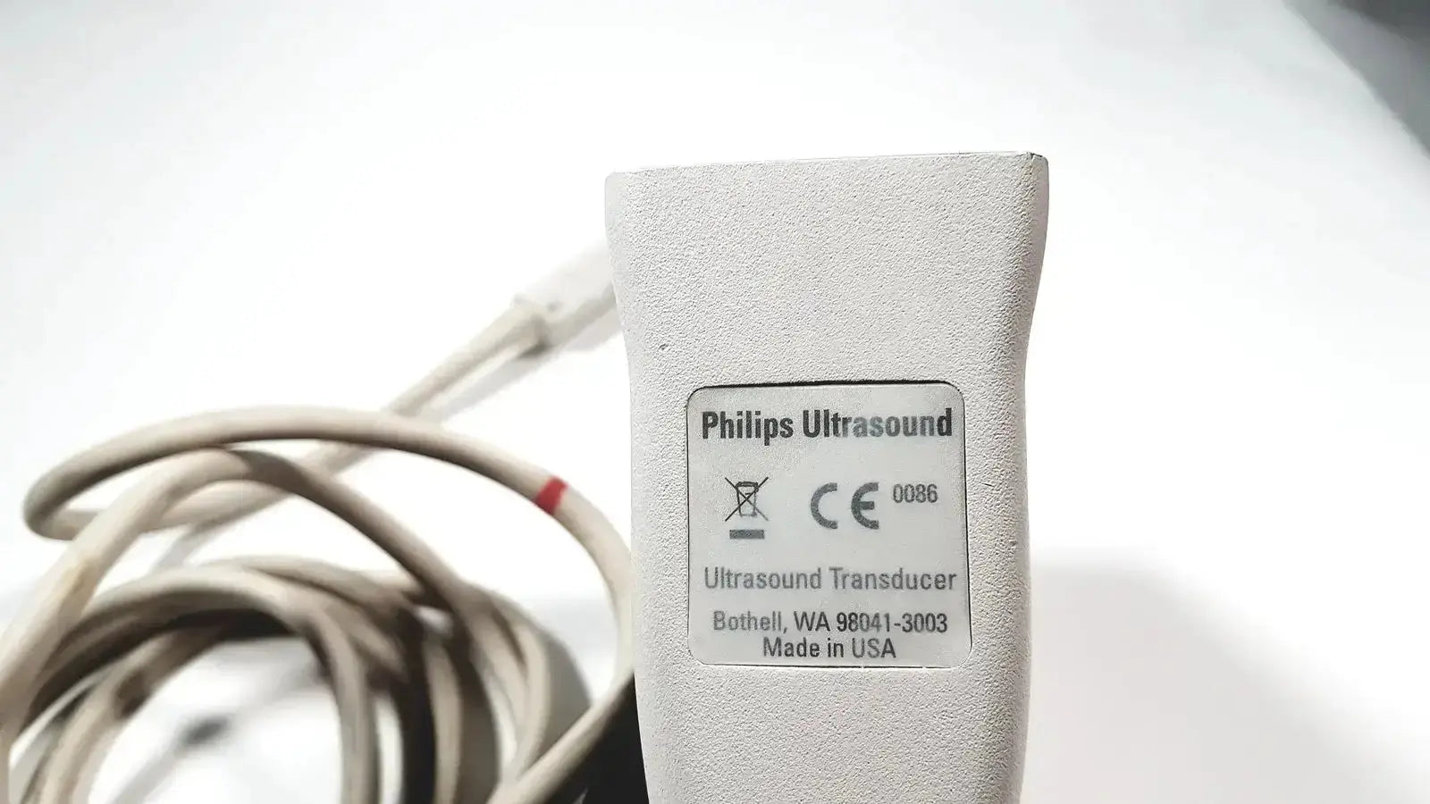 Gray Philips L15-7io linear array ultrasound transducer probe with textured surface and white model label for iU22 use