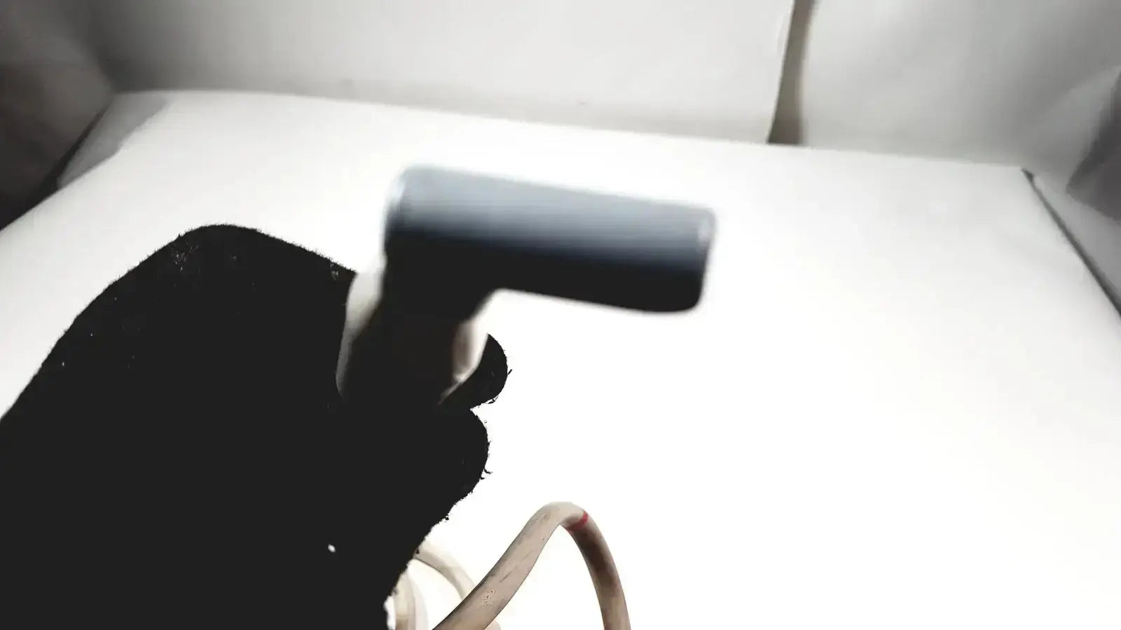 Black rubber-handled nozzle of philips l15-7io linear array ultrasound transducer probe for iU22 device