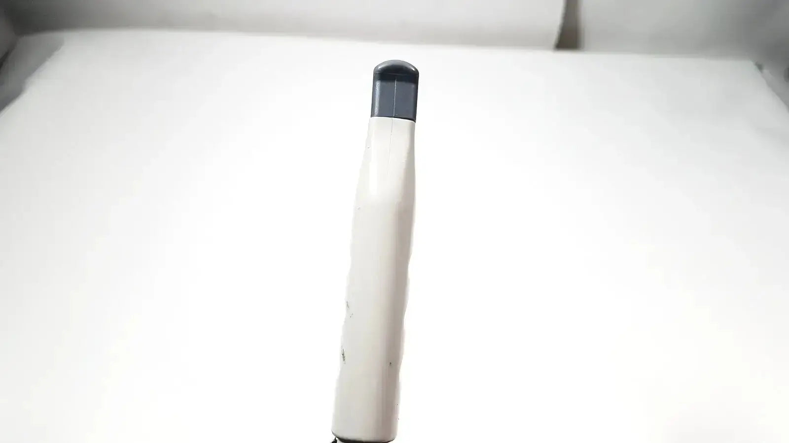 Philips L15-7io linear array ultrasound transducer probe in white and gray with sleek cylindrical design for iU22