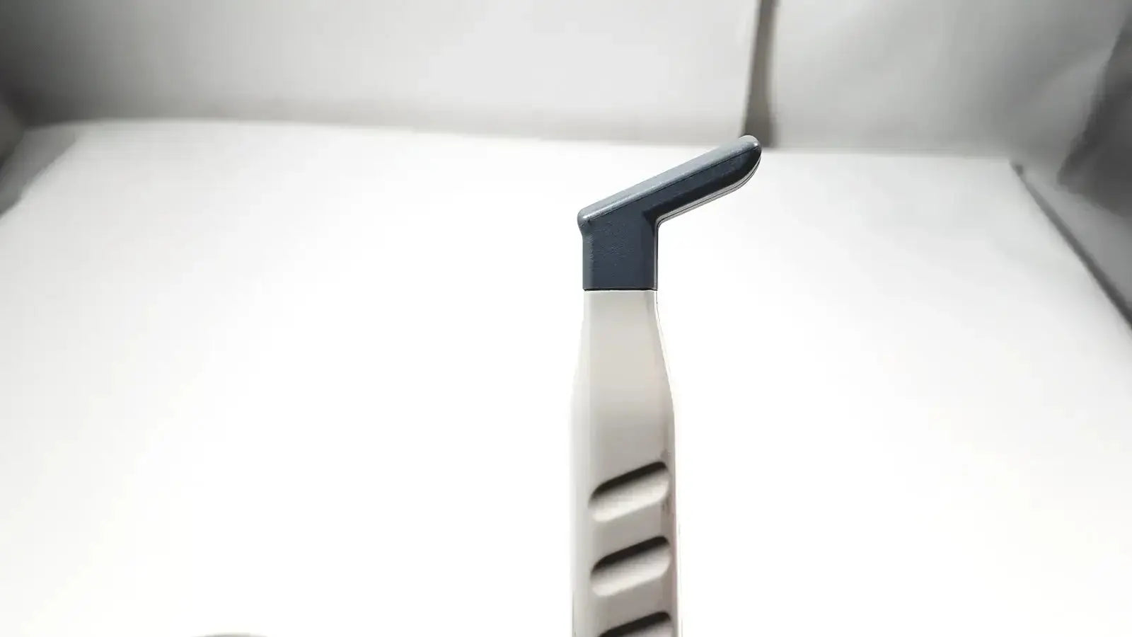 Philips L15-7io gray and white plastic linear array ultrasound transducer probe with curved handle and ridged grip for iU22