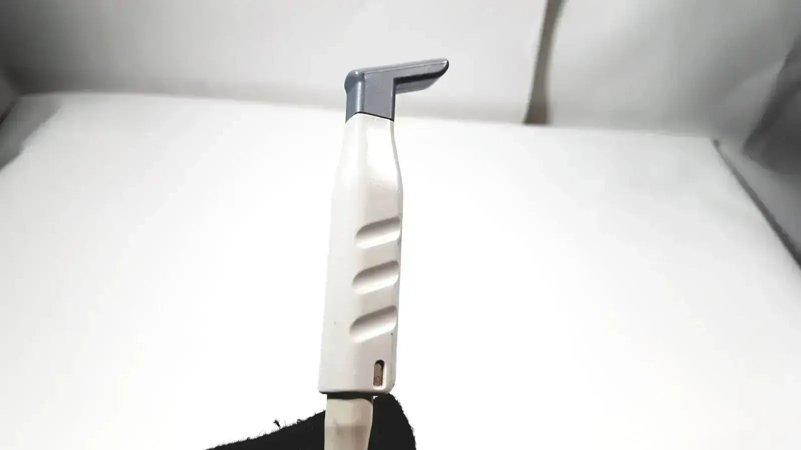 White and gray plastic-handled philips l15-7io linear array ultrasound transducer probe with ergonomic design