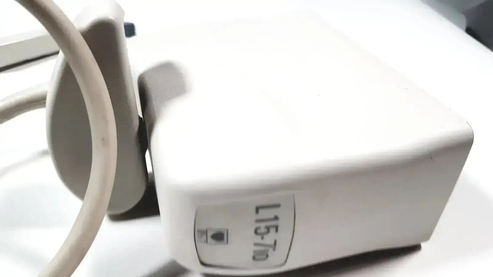White rectangular power adapter with beige cord and l15 slash 70 label for philips l15-7io linear array ultrasound transducer probe