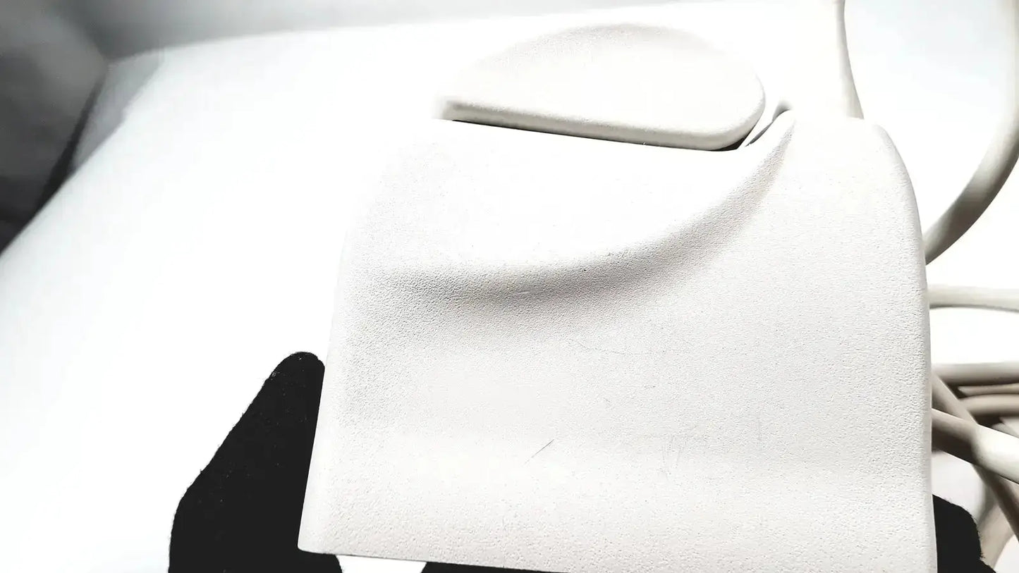 White textured leather wallet with smooth rounded flap closure shown with philips l17-5 linear array ultrasound transducer probe
