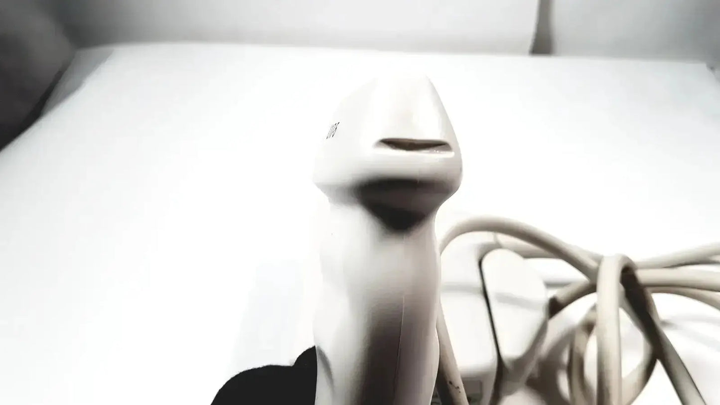 White handheld barcode scanner with coiled cord shown alongside philips l17-5 linear array ultrasound transducer probe