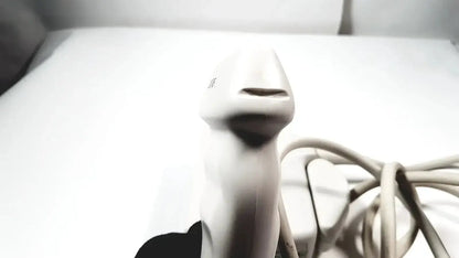 White handheld barcode scanner with coiled cord shown alongside philips l17-5 linear array ultrasound transducer probe