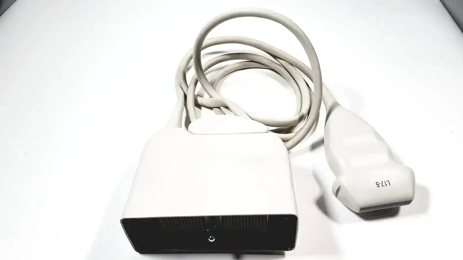 Philips l17-5 white ultrasound transducer probe with coiled cable and black base featuring model number l17 s