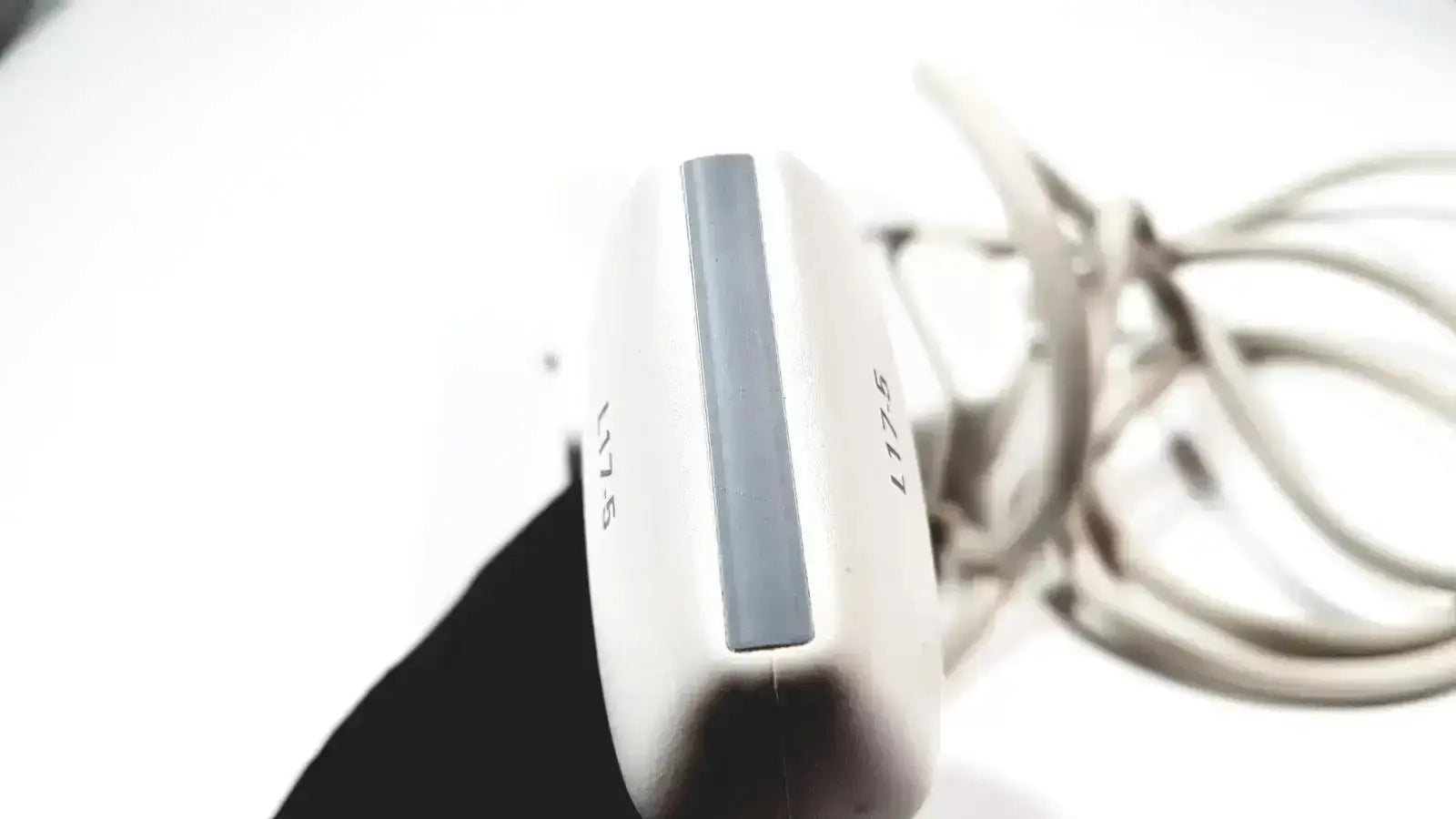 White and gray handheld Philips L17-5 linear array ultrasound transducer probe with a sleek modern design