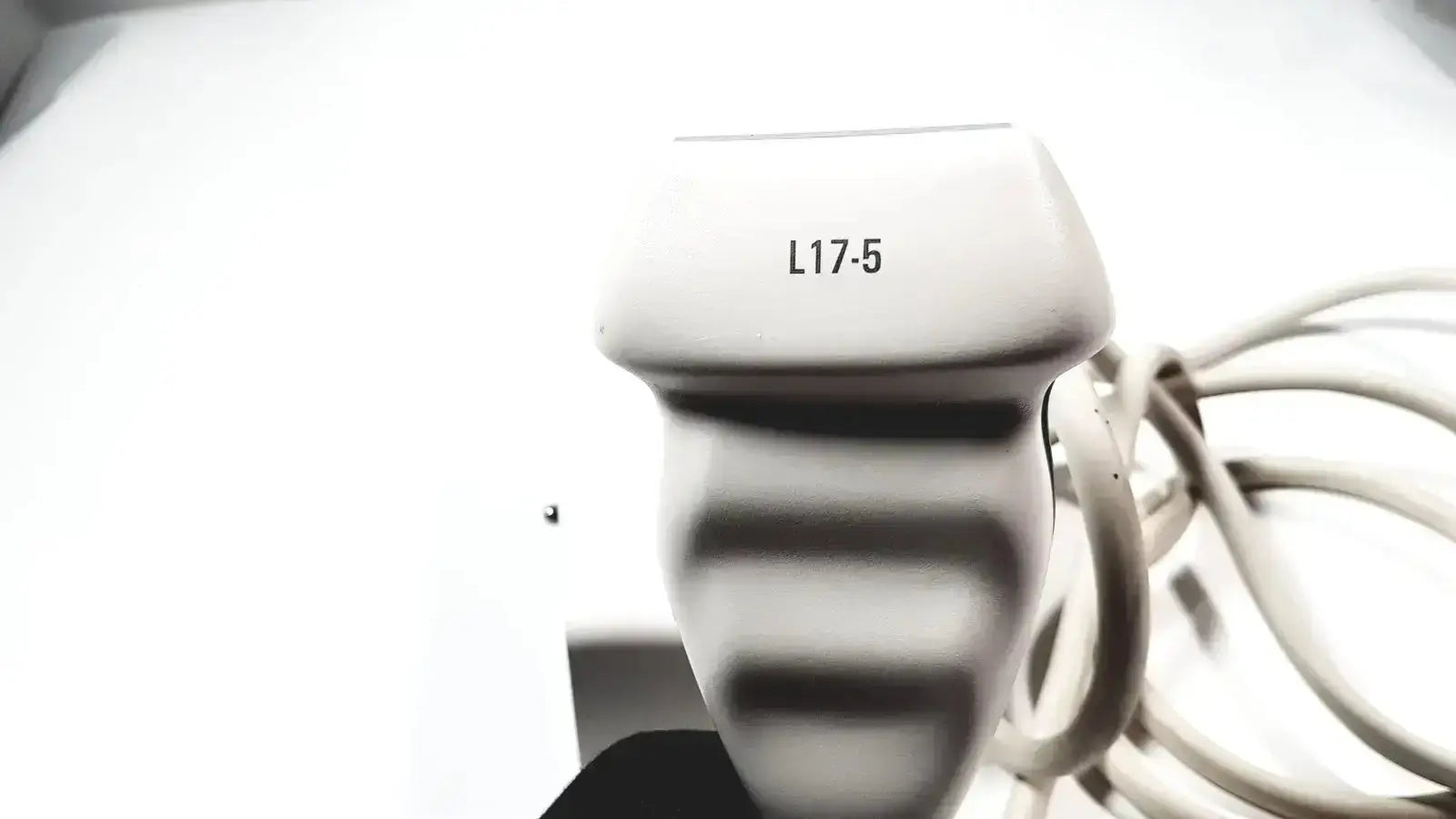 White plastic Philips L17-5 linear array ultrasound transducer probe with l17-5 printed on top