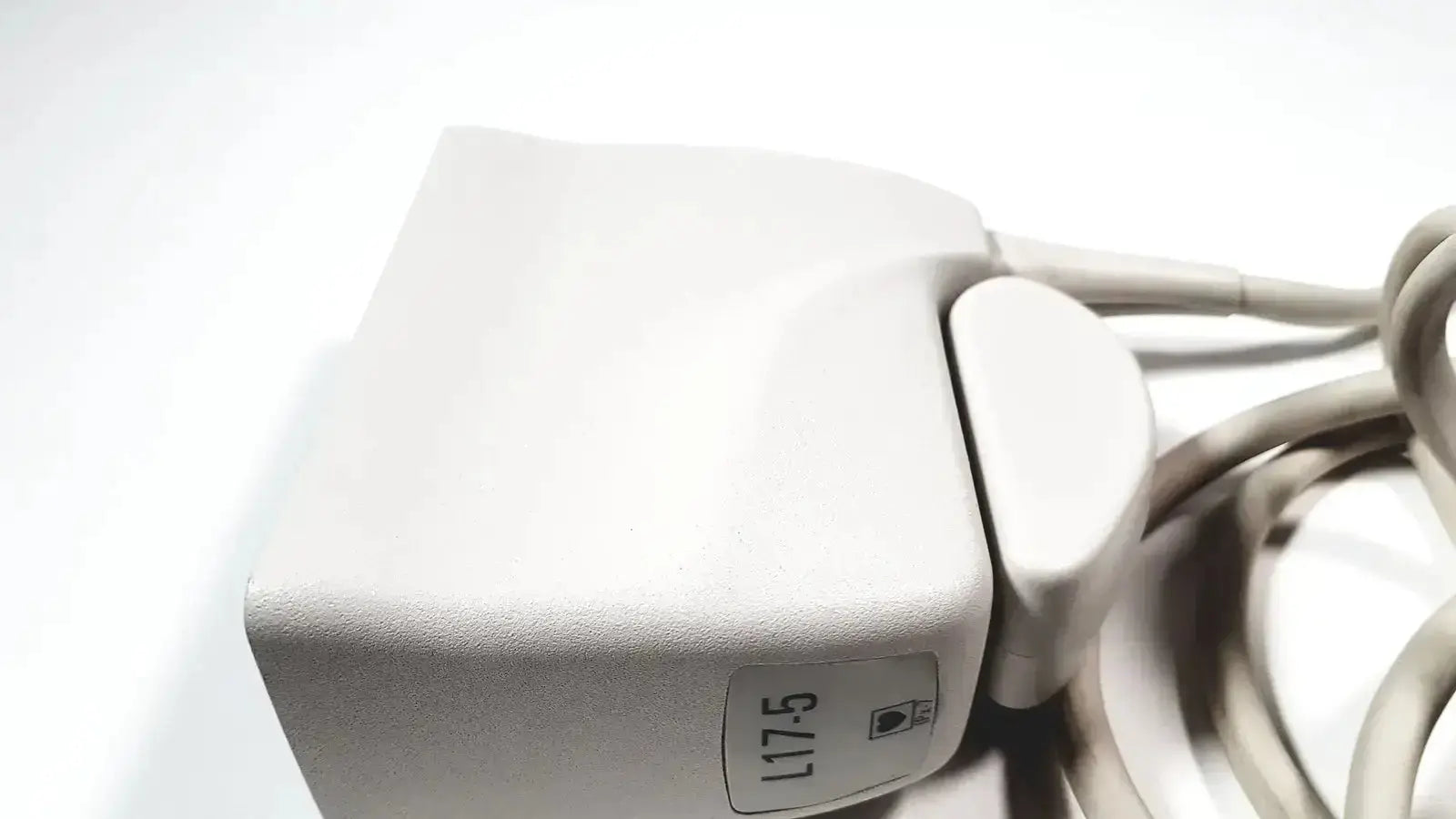 Philips L17-5 linear array ultrasound transducer probe with white matte plastic body and coiled gray cables