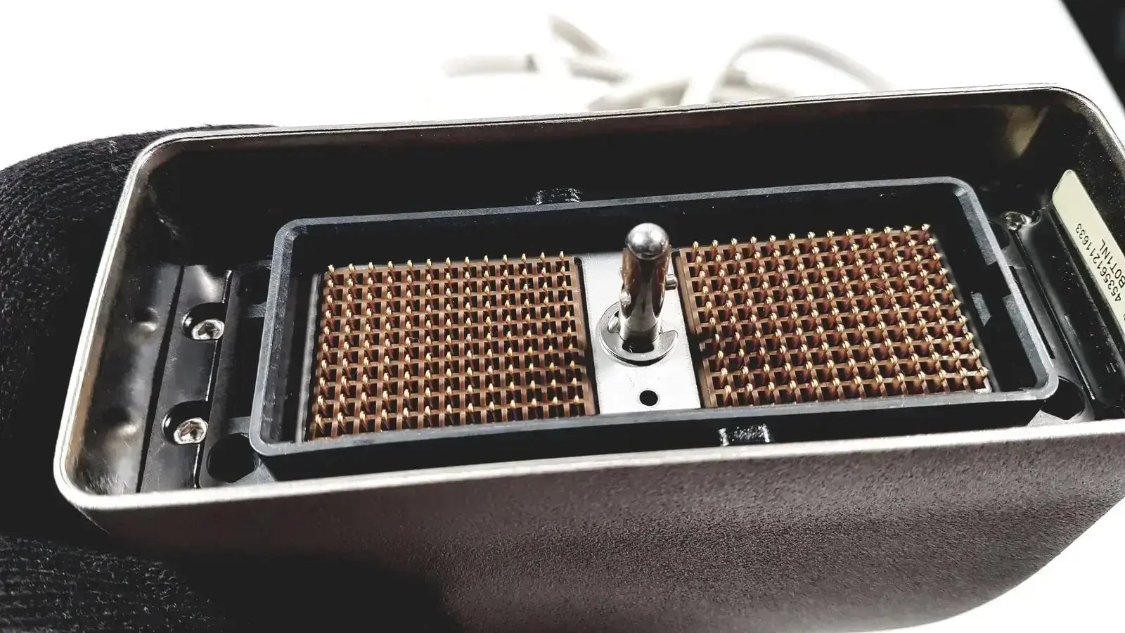 Black rectangular housing of philips l17-5 linear array ultrasound transducer probe with brown circuit boards and joystick component