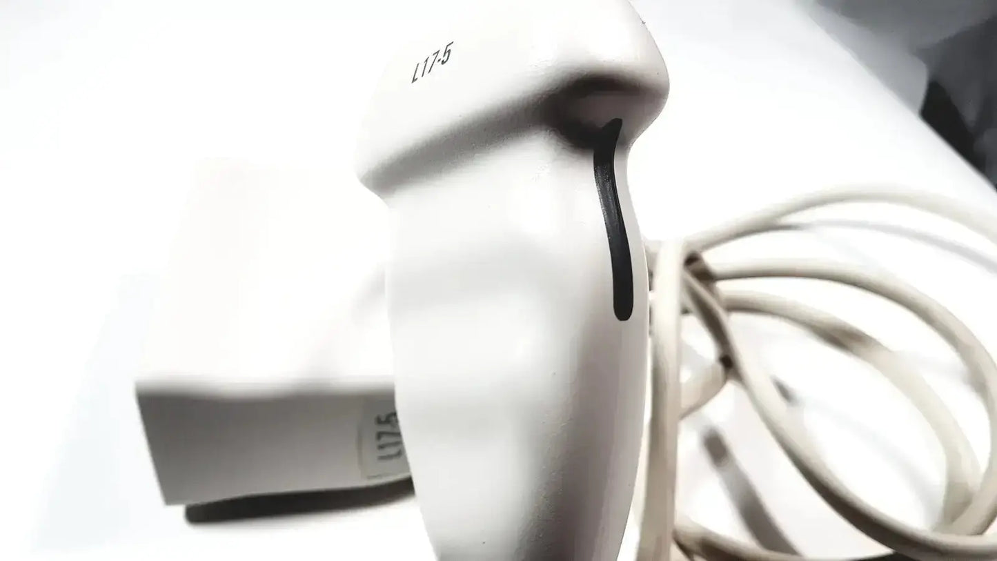 White handheld Philips L17-5 ultrasound transducer probe with black grip line and l175 model number printed on its side