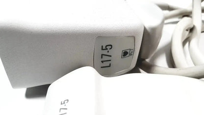 White plastic Philips L17-5 linear array ultrasound transducer probe with label and heart icon visible on device