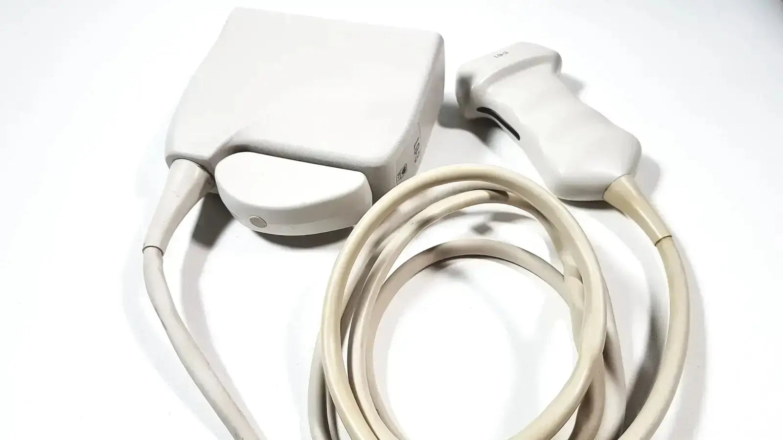 Cream-colored philips l9-3 linear array ultrasound transducer probe set with control unit for iU22 ultrasound system