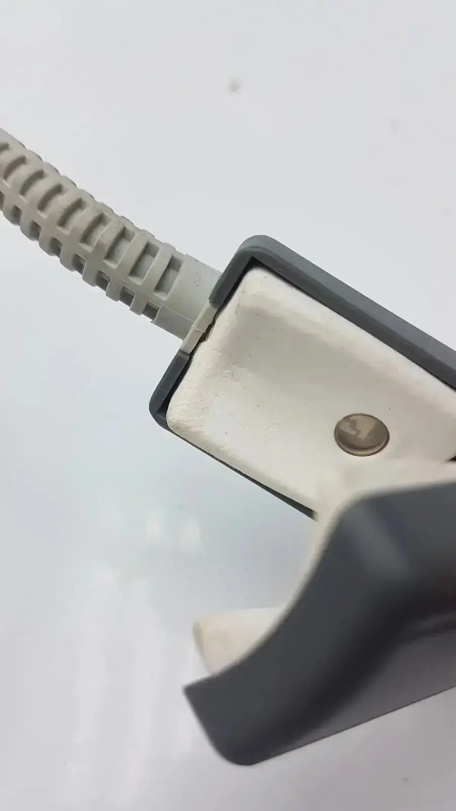 Gray plastic cable clamp with ribbed beige cord in philips m1196t reusable adult spo2 clip sensor connector