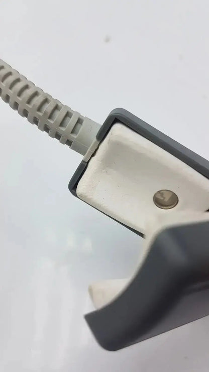 Gray plastic cable clamp with ribbed beige cord in philips m1196t reusable adult spo2 clip sensor connector