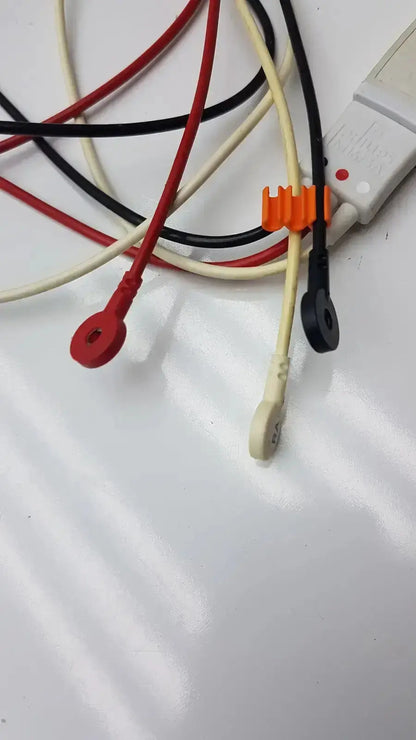 A bundle of multicolored medical test leads with plastic connectors and an orange clip for philips m1673a trunk cable