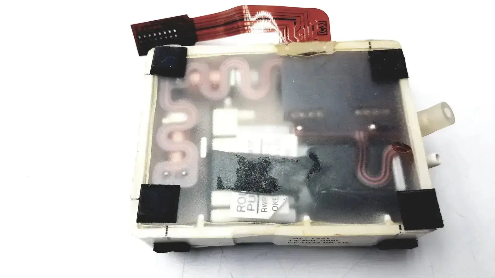 Clear plastic enclosure housing white and black electronic component with red circuitry in philips m3000-60001 pump assembly module