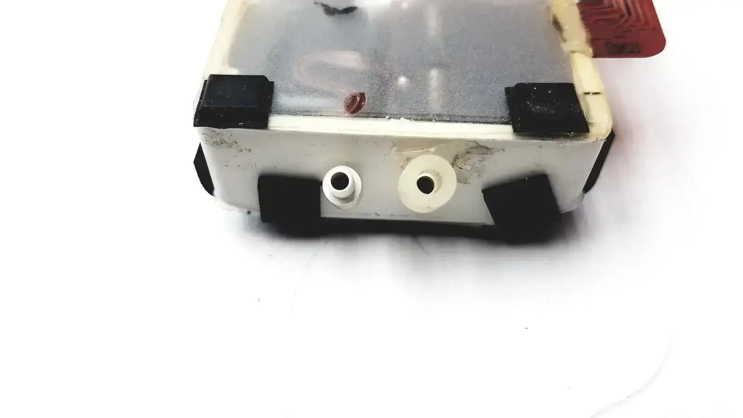 White plastic philips m3000-60001 pump assembly module with black rubber feet and two circular front ports