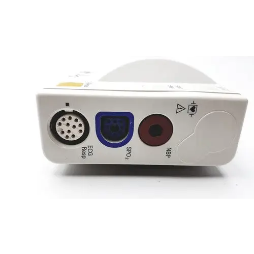 White medical monitor with three distinct ports: a black circular port labeled ’ecg resp,’ a blue square port labeled ’spo2,’ and a red circular port labeled ’nbp.’