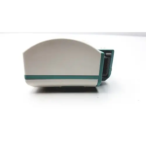 White and teal plastic device with a curved top and rectangular base.