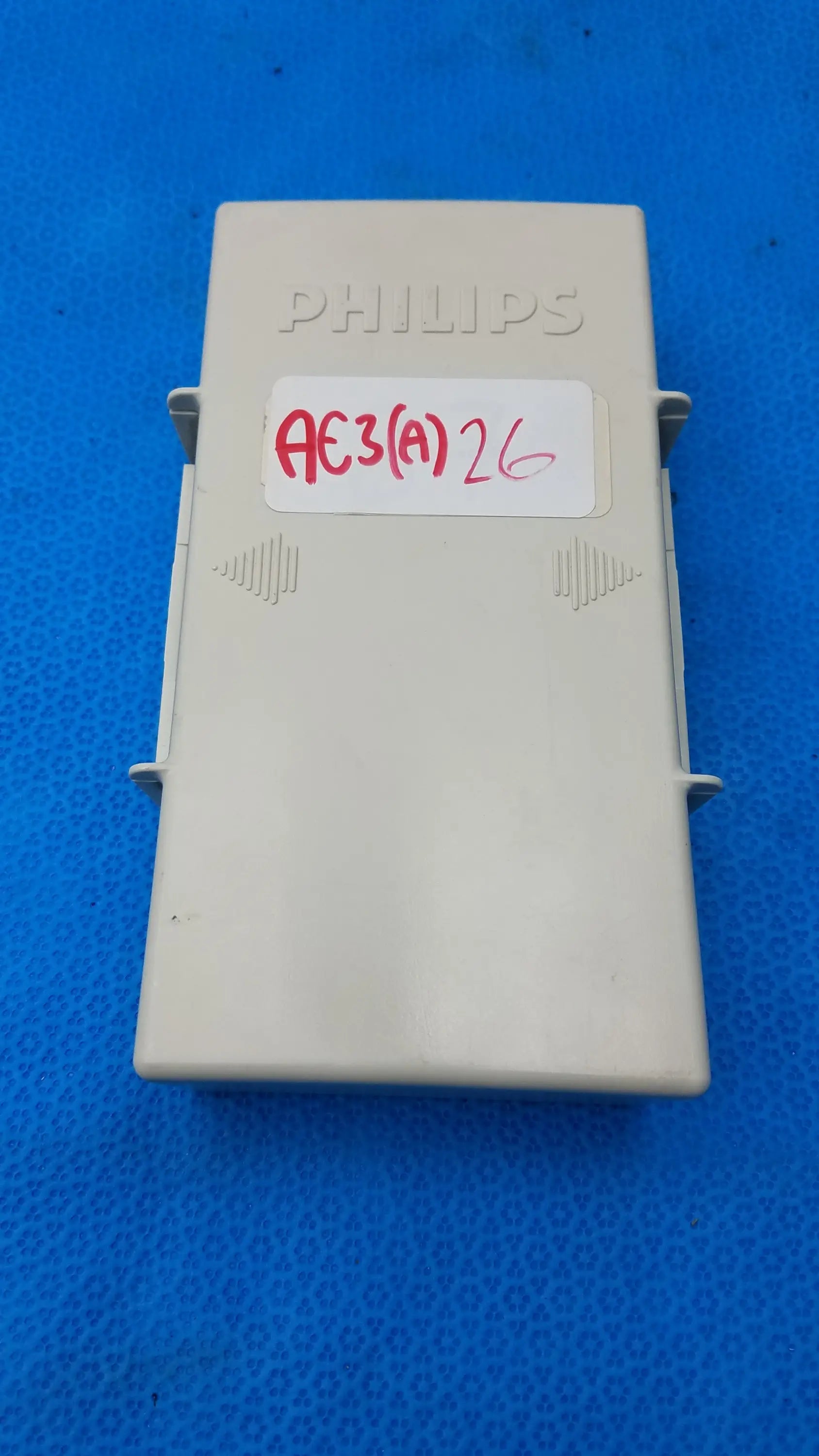 Beige Philips AE3(a)26 plastic electrical box with embossed branding and side latches for Philips M3538A HeartStart MRx medical equipment
