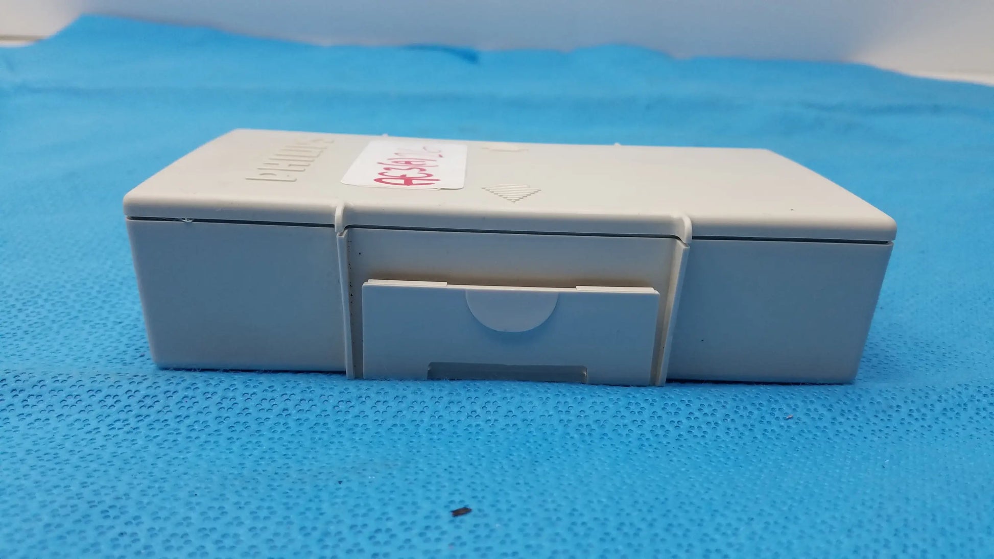 Gray plastic medication box with small front drawer for philips m3538a heartstart mrx medical equipment battery storage