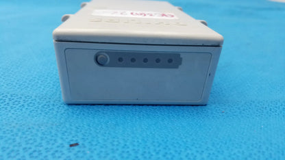 Gray plastic philips m3538a heartstart mrx lithium ion battery with circular button and five indicator lights for medical equipment